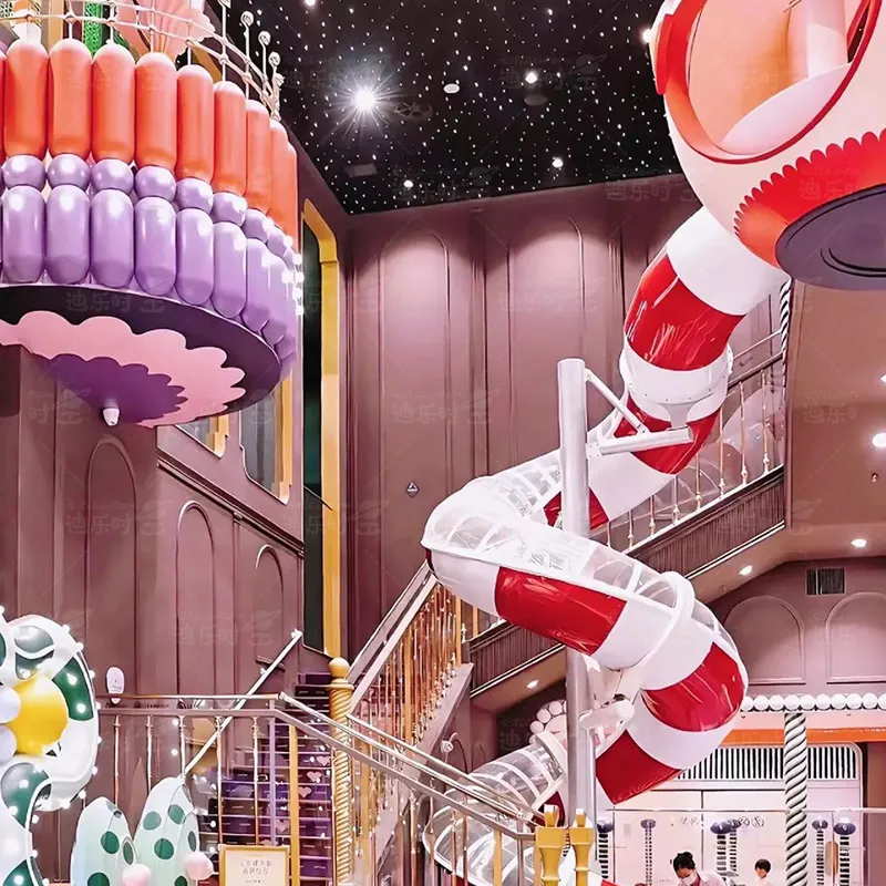 Indoor children's playground, brightly colored loudspeaker slides, rotating slides