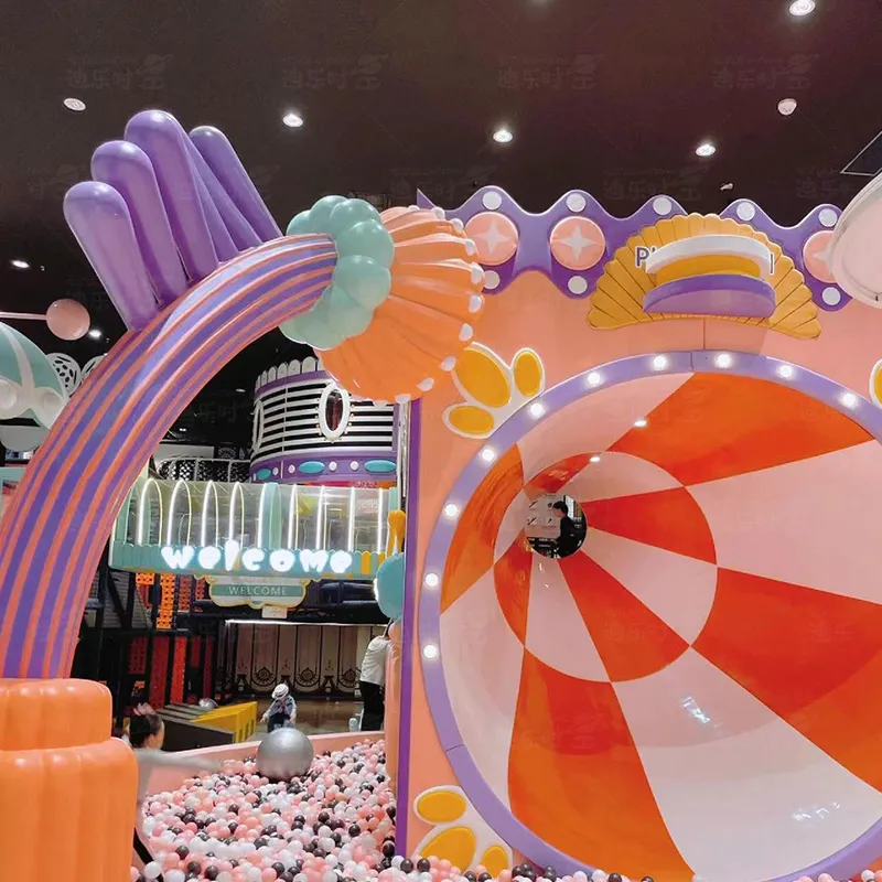 Indoor children's playground, brightly colored loudspeaker slides, rotating slides